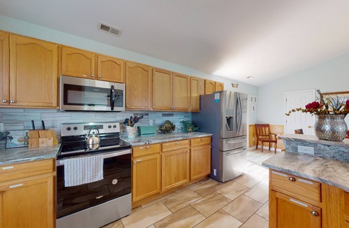 Wind Over Waves House | Renovated water-view house with private pool, hot tub, game room, & central AC