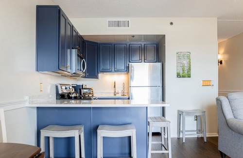 Wilmington Historic District Condo | Riverfront condo with USS North Carolina view, balcony, central AC, and w/d