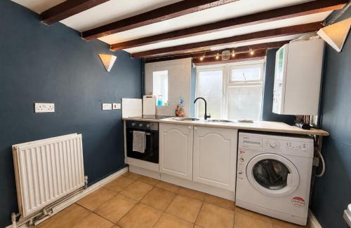 Crowborough House | Rustic 18th century stone cottage with fireplace and parking