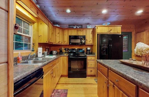Cullowhee House | Spacious cabin near lake & boat ramp with firepit, foosball, bar, decks & WiFi