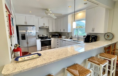 Ocracoke House | Spindrift: Spacious dog friendly canal front home, dock, decks, views