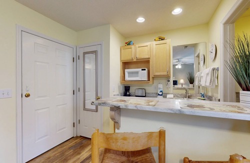 St. James Condo | STJ22B: Coastal Condo with golf course view and shared pool access