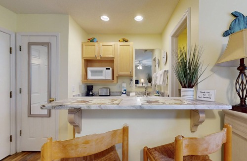 St. James Condo | STJ22B: Coastal Condo with golf course view and shared pool access