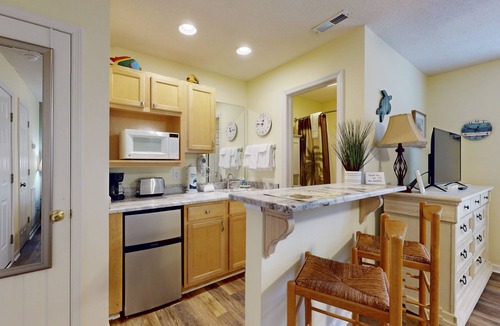 St. James Condo | STJ22B: Coastal Condo with golf course view and shared pool access