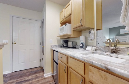 St. James Condo | STJ22B: Coastal Condo with golf course view and shared pool access