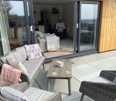 Bishopstone Apartment | Studio Cabin Retreat with Hot Tub Sea and Downs views in Seaford with own garden