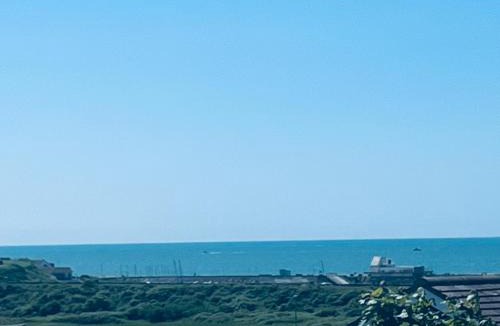 Bishopstone Apartment | Studio Cabin Retreat with Hot Tub Sea and Downs views in Seaford with own garden