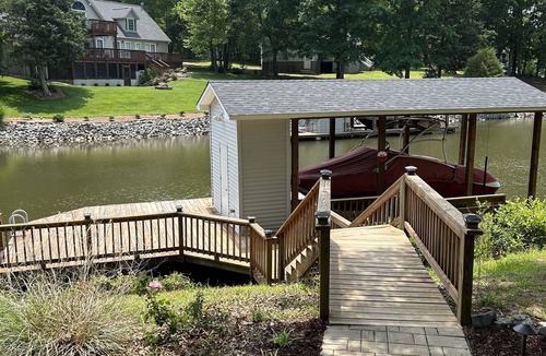 Henrico House | Stunning Lake Gaston waterfront! Renovated 3BR 2BA with dock on an acre lot.