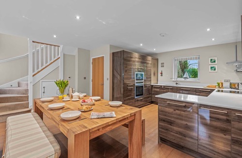 Talland House | Stylish and contemporary pet friendly property featuring a wood-burning stove, patio hot tub and lar