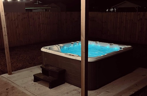 Graham House | Stylish downtown home: private hot tub, outdoor pizza oven & bumper pool table