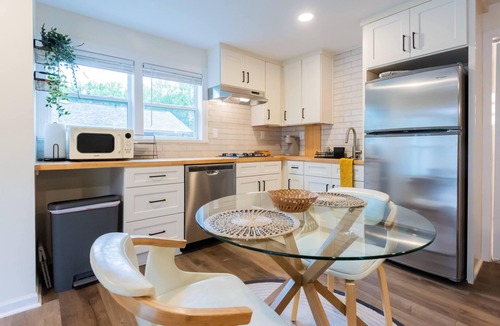 Sunset Road Cottage | Stylish renovated cozy cottage studio in quiet neighborhood 10 minutes to Uptown
