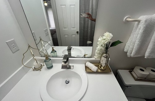 Greensboro House | Stylish Townhome Guest Room with Guest Bath