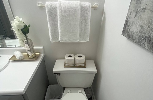 Greensboro House | Stylish Townhome Guest Room with Guest Bath
