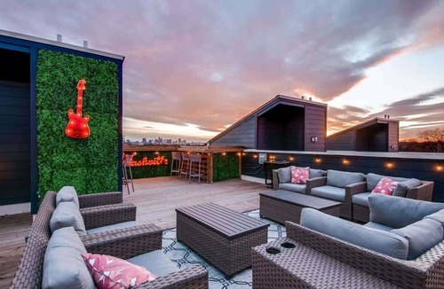 Talbot's Corner House | Summer rooftop deck, game room, skyline views near Broadway