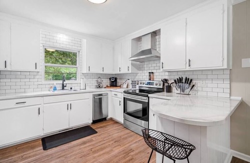 Greensboro House | The Boro Bungalow. A Mid-modern home. King beds.