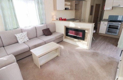 Ferryside Cottage | UNDER CLIFF CARAVAN, family friendly, with pool in Ferryside