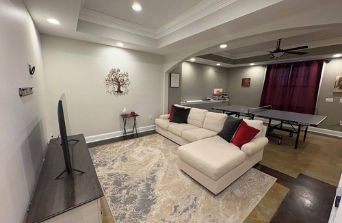 Raleigh Apartment | Walkout Basement apartment with a private entrance facing a wooded backyard.