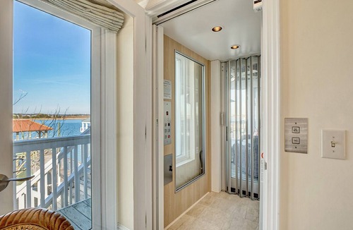 South End House | Waterfront 5 BR home w/incredible views, dock, boat slips, & elevator!