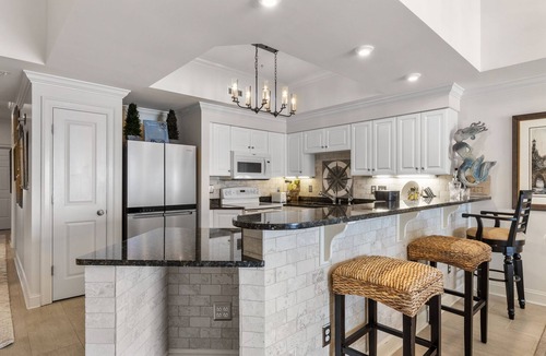 Indian Beach Condo | Waterfront condo with balcony, grill, washer/dryer, AC, pool, game room, & gym