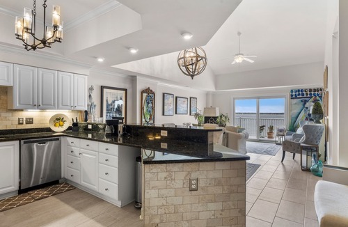 Indian Beach Condo | Waterfront condo with balcony, grill, washer/dryer, AC, pool, game room, & gym