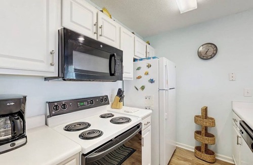 Carolina Yacht Landing Condo | Waterfront condo with pool, private balcony, close to beach & golf