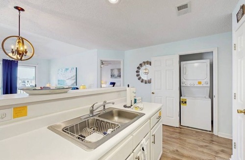 Carolina Yacht Landing Condo | Waterfront condo with pool, private balcony, close to beach & golf