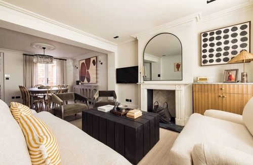 Royal Borough of Kensington and Chelsea House | Welcome to our newly renovated 4-bedroom, 2-bathroom retreat in the heart of Kensington. Warm tones, plush textures, and elegant touches create a serene space. Unique artworks and opulent accents add character throughout. Perfect getaway starts here.