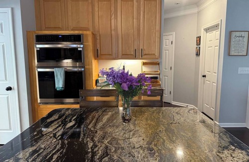 Greensboro House | Welcome to The Clovelly, a spacious 2-story vacation home that blends charm with modern comfort. Perfect for families, friends, or groups, this cozy retreat features inviting living spaces, a fully equipped modern kitchen & comfortable bedrooms.