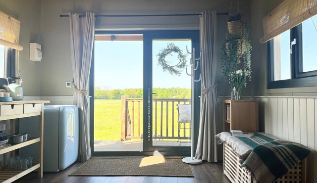 1br-sleeps2-field View-parking-cabin Experience
