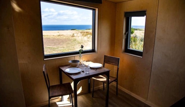 5 rustic cabins, sea views from rewilded farm