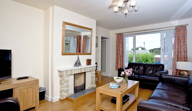 A family friendly retreat with large garden, close to a secluded cove.