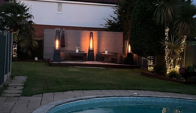 A serene quiet oasis with 3 separate buildings large garden & heated pool