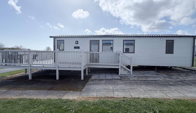 Caravan with a spacious decking area at Sand le Mere Park, Yorkshire ref 71062ME