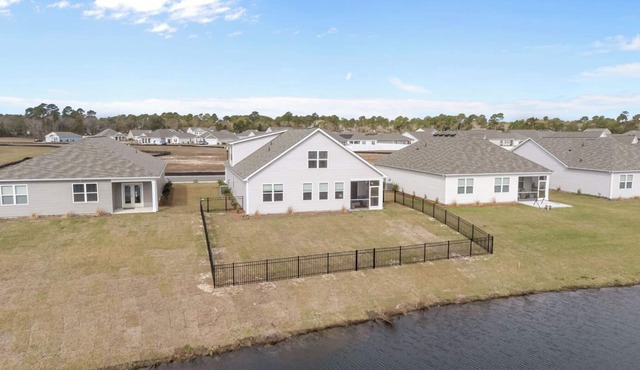 Coastal Family Getaway Near Holden Beach with water views, covered patio & games