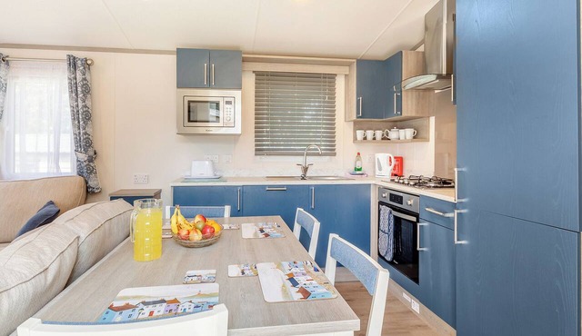 Comfortable and modern 12ft-wide caravan with one double and one twin bedroom.