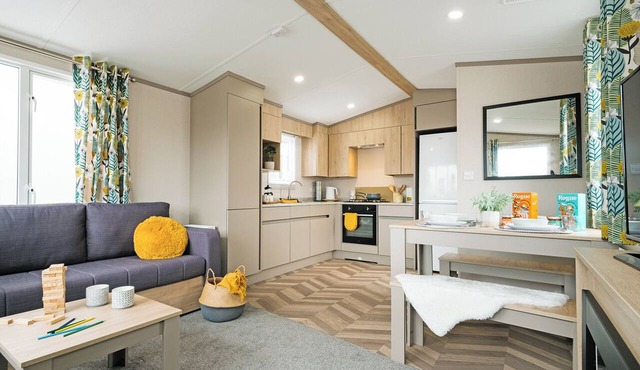 Comfortable, modern two-bedroom caravan sleeping four people.