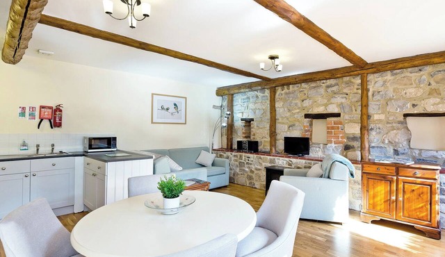 Courtyard setting alongside 16 other converted farm buildings.