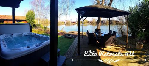 Elite Retreats 4U Lakeside Hot Tub Log Cabin with the fishing peg at Tattershall Lakes Park