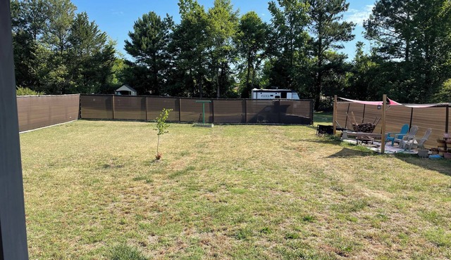 Lovely 2-bed 2-bath house with firepit in fenced in yard in charming Youngsville
