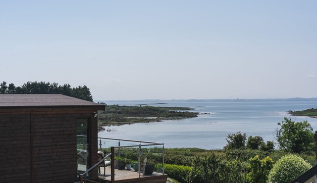 Set on an elevated private site with commanding views over Strangford Lough.