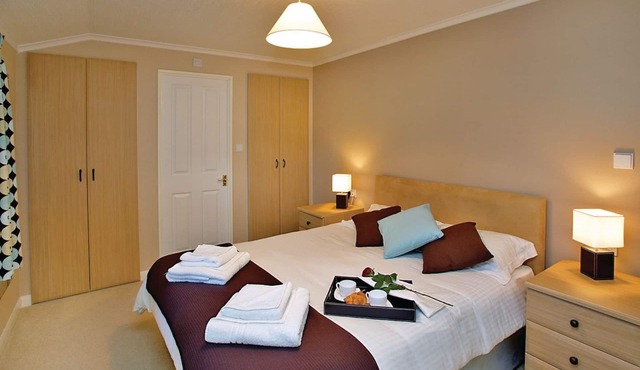 Spacious and contemporary lodge with one king size double with ensuite shower and one twin.