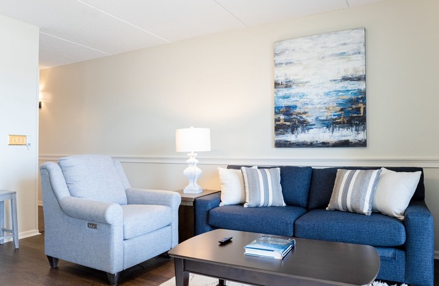 Riverfront condo with USS North Carolina view, balcony, central AC, and w/d