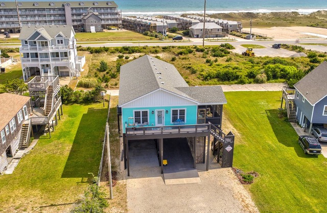 Welcoming home with screened porch, outdoor shower, elevator & central AC