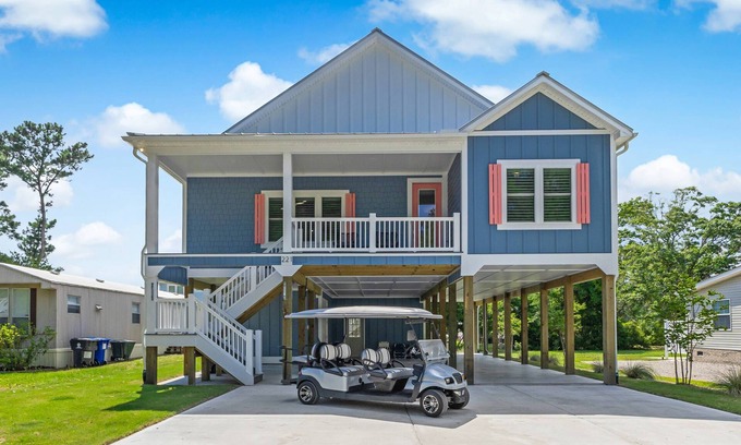 Tranquil Harbour House | Luxurious 4-Bedroom Dog-Friendly Retreat in Oak Island w/6 Seater Golf Cart & 7 Person hot tub