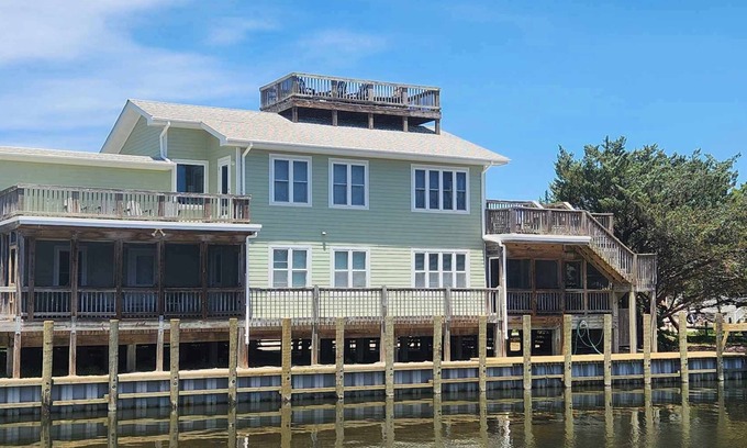 Ocracoke House | Spindrift: Spacious dog friendly canal front home, dock, decks, views