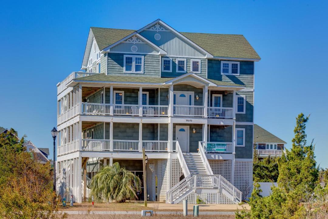 Photo of Buildings in Wind Over Waves