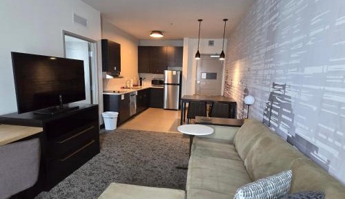 One-Bedroom Suite with Two Queen Beds with Sofa Bed and Roll-In Shower - Mobility Accessible