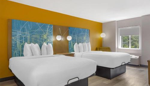 Queen Suite with Two Queen Beds and Sofa Bed
