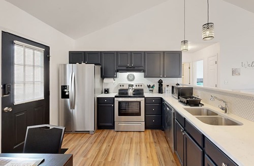 Salisbury House | Perfectly located home with deck, open layout, smart TVs, central AC, & W/D